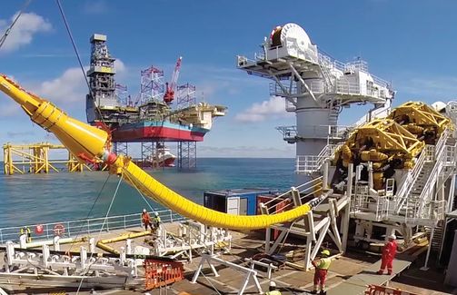 Cable laying vessel NKT Victoria installing an offshore cable with platform Martin Linge in the background